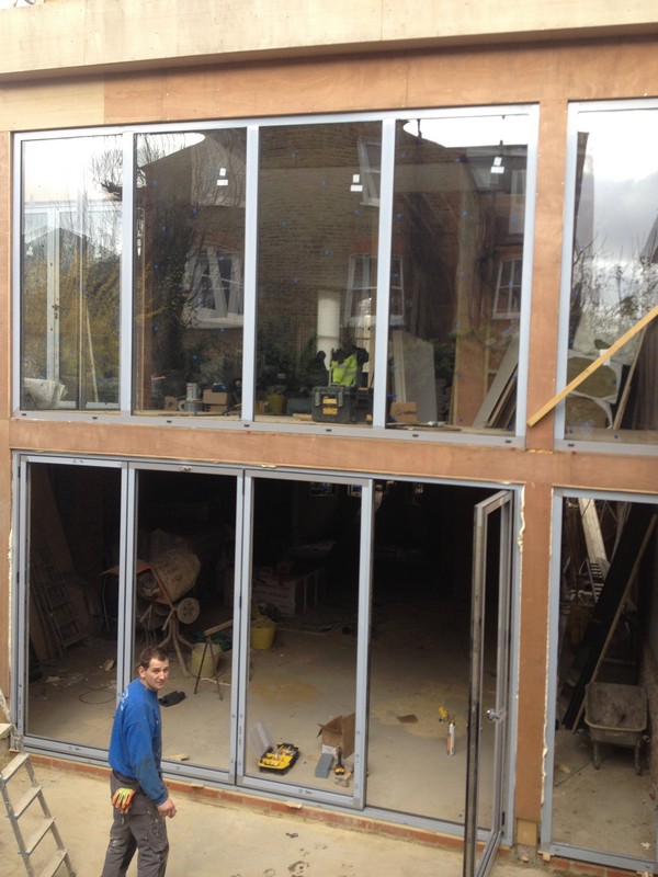 Aluminium bi-fold doors with two-storey glazing in Abbey Wood