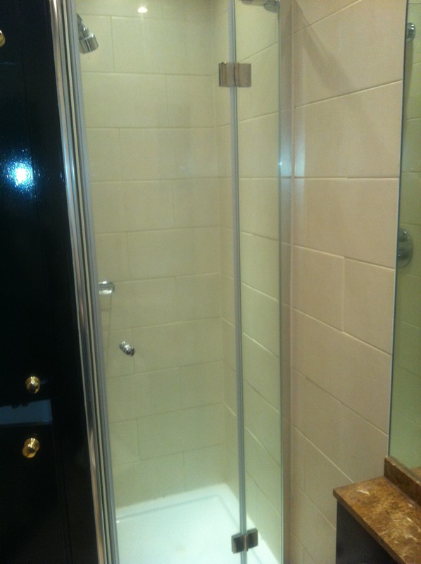 Frameless glass shower enclosure with chrome fittings in Abbey Wood