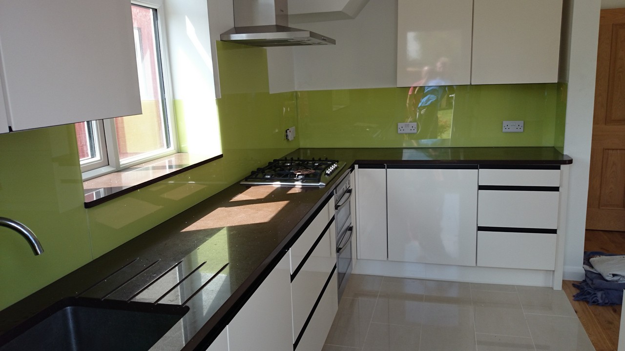 Lime green glass kitchen splashback installed by Abbey Wood glaziers