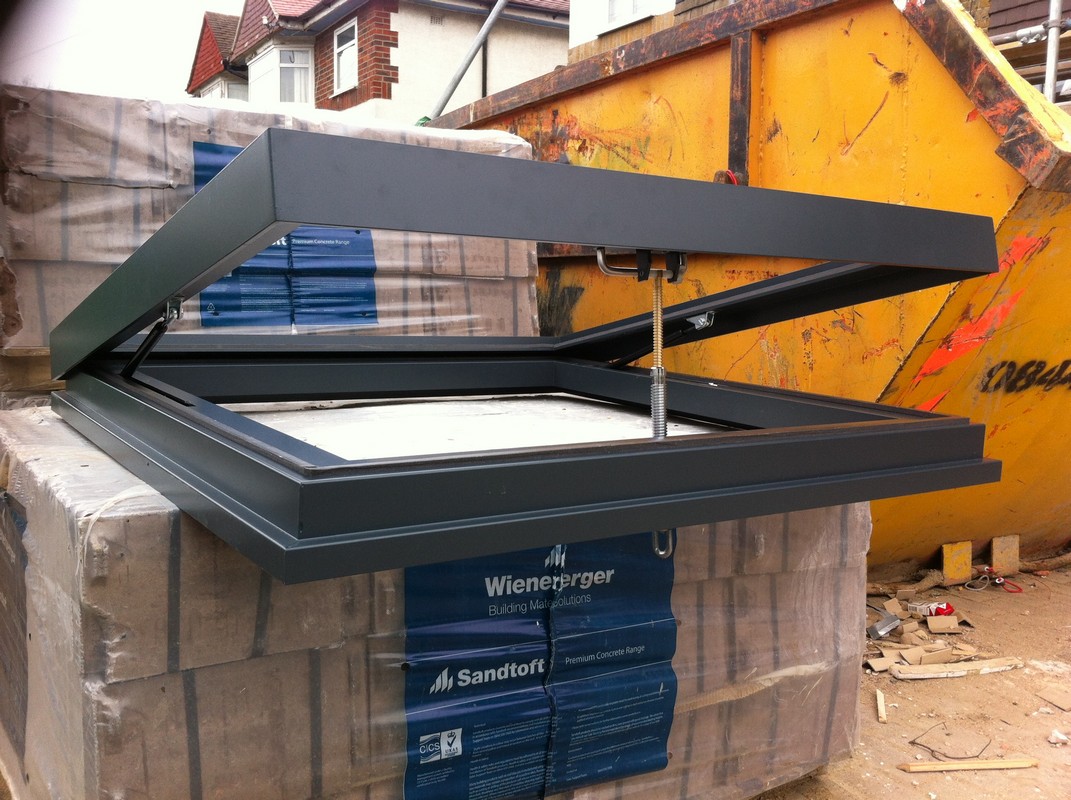 Opening flat roof skylight in anthracite grey installed in Abbey Wood