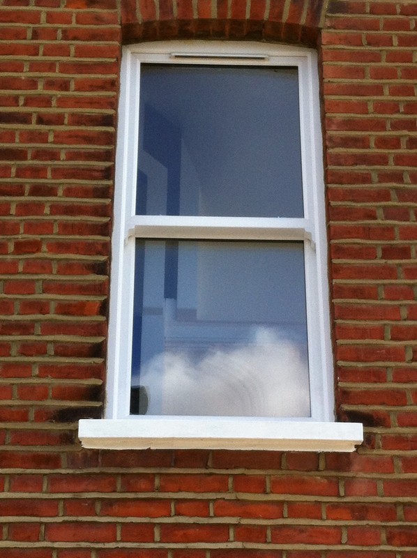 uPVC sash window on Victorian red brick house in Abbey Wood